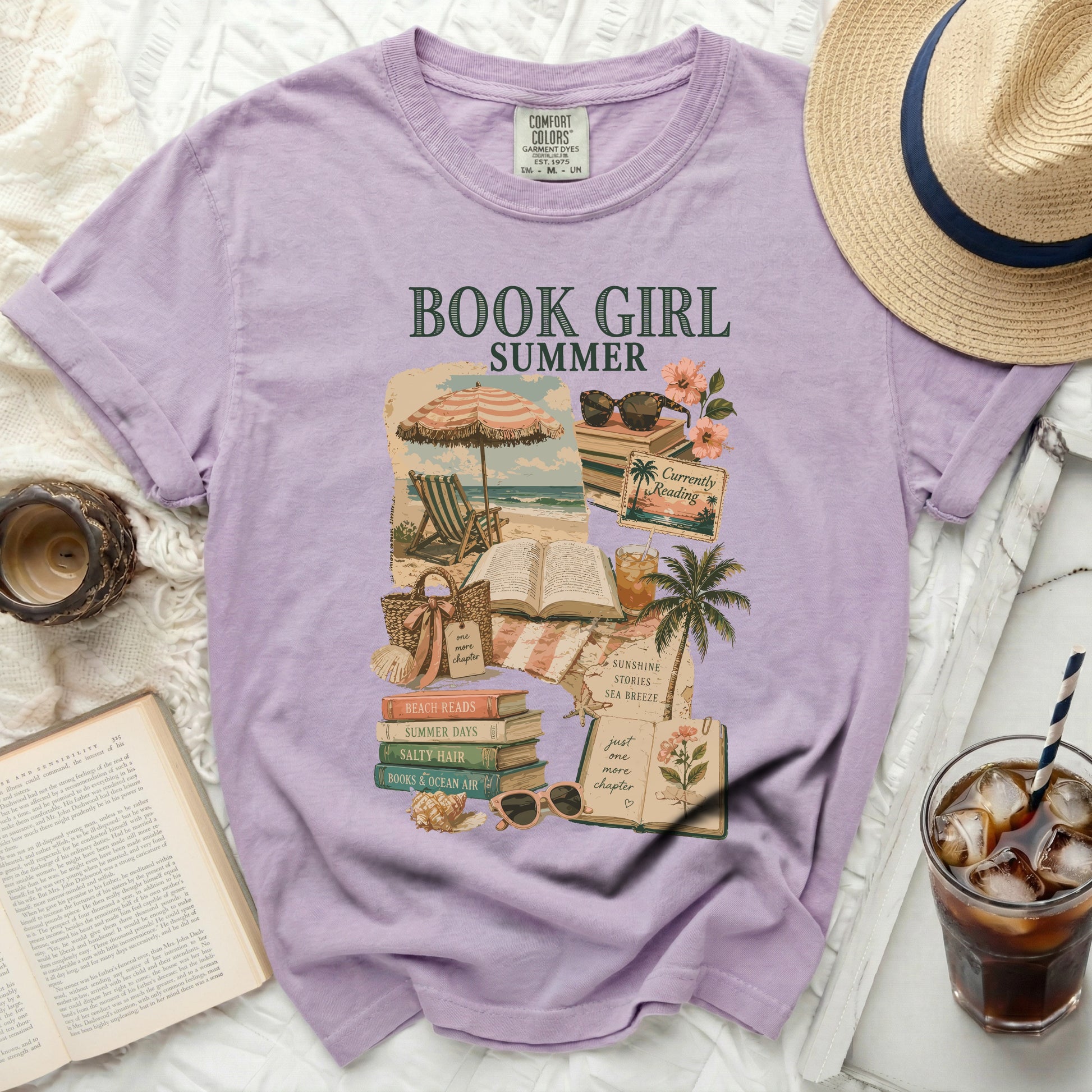 Purple t-shirt with "BOOK GIRL" graphic featuring beach scenes and books.
