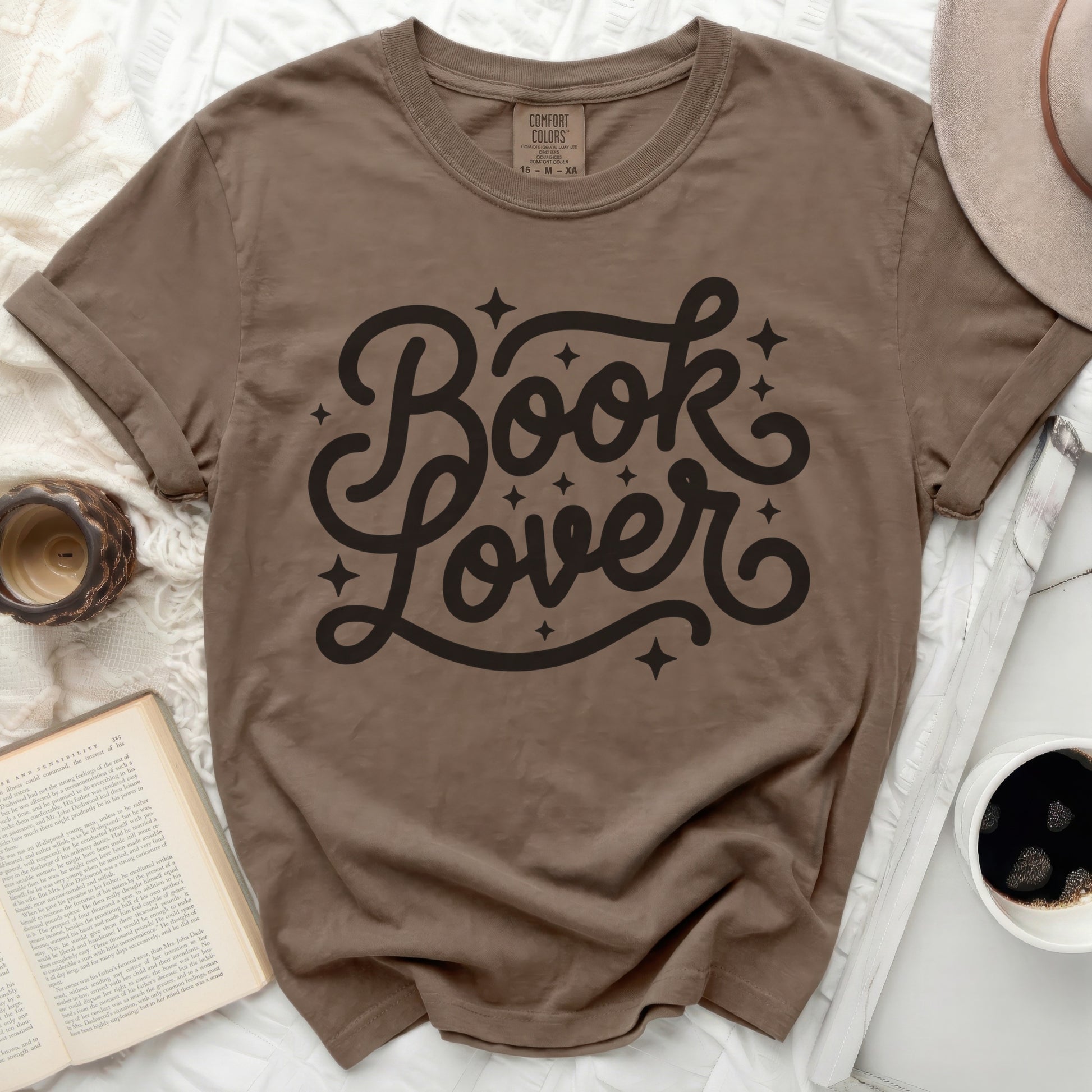 Brown t-shirt with black "Book Lover" graphic and stars.