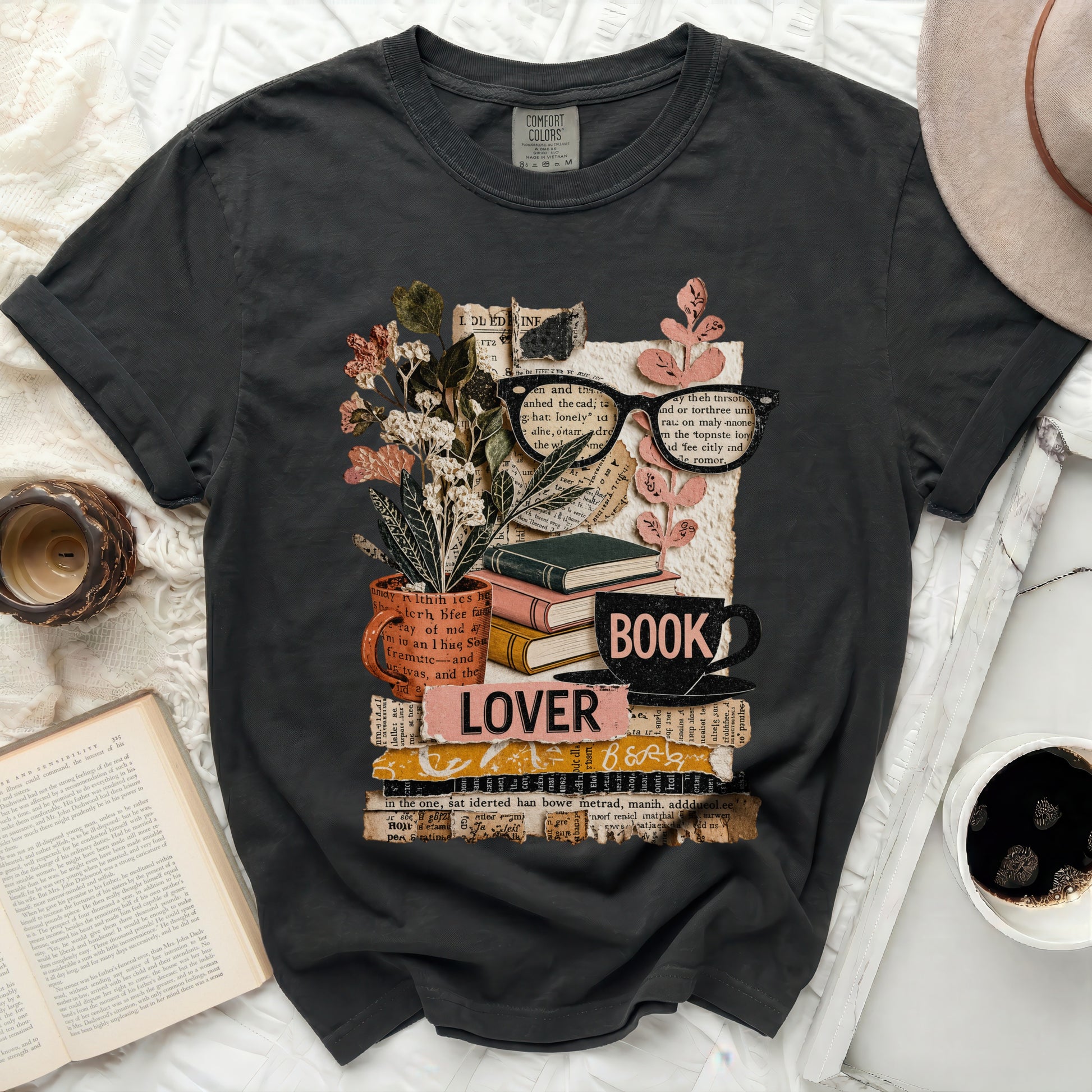Graphic tee with stack of books, glasses, flowers, and "LOVER BOOK" text.