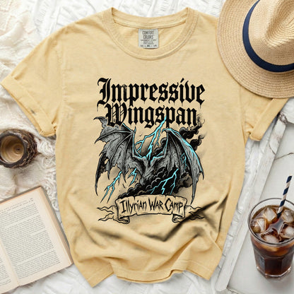Yellow t-shirt with "Impressive Wingspan" and a dragon graphic.