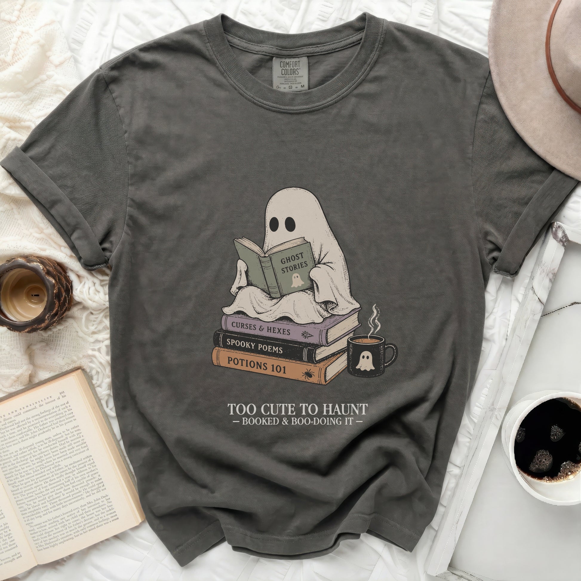Ghost reading "Ghost Stories" book on pile of Halloween-themed books.