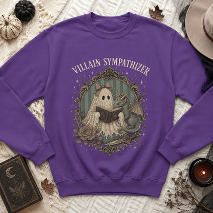 Purple sweatshirt with a ghost and dragon reading a book, text reads "VILLAIN SYMPATHIZER".