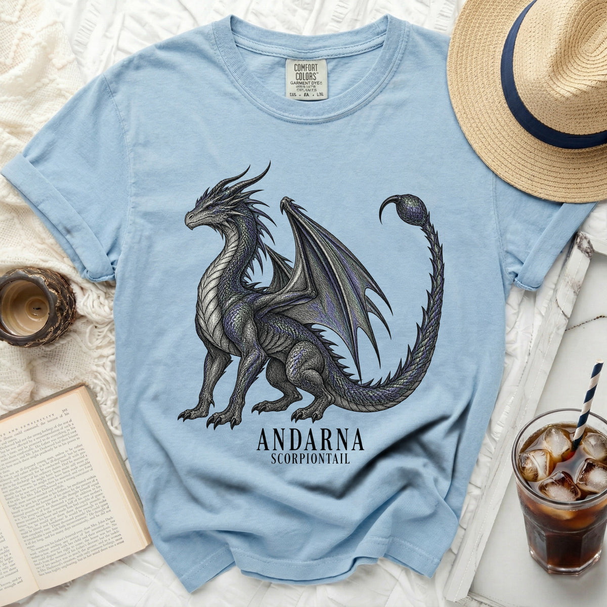 Light blue t-shirt with a black and gray dragon graphic and "ANDARNA SCORPIONTAIL" text.