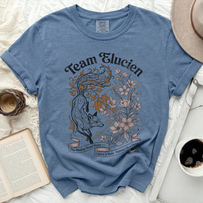 Blue t-shirt with "Team Elucien" and a fox with floral designs.