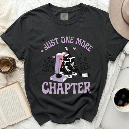 Black t-shirt with "Just One More Chapter" text, books, and ice skates.