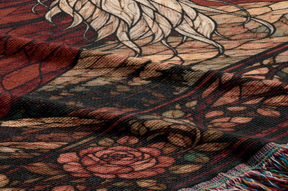 The image is a close-up of a textured fabric with a floral pattern, featuring a large rose design in the center.