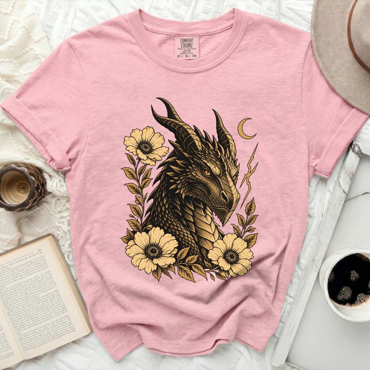Pink t-shirt with a golden dragon head and flowers graphic and Comfort Colors tag.