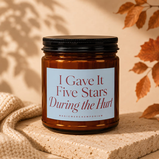 Amber glass candle with white label reading "I Gave It Five Stars During the Hurt".