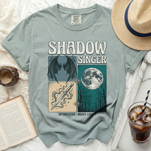 Shadow Singer t-shirt with dragon wings, dagger, moon, and trees graphic.