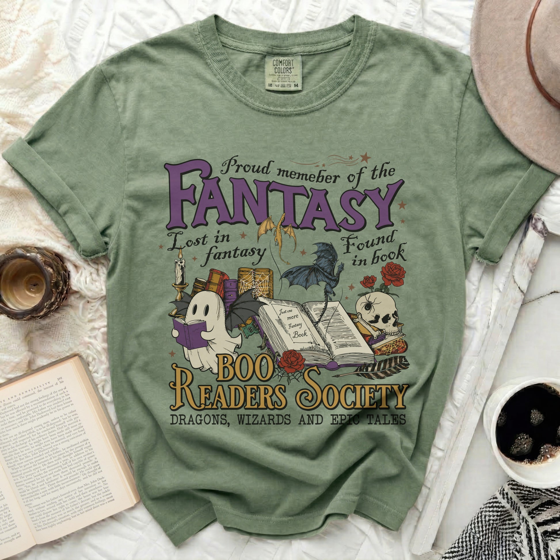 Green t-shirt with fantasy graphics and "Boo Readers Society" text.
