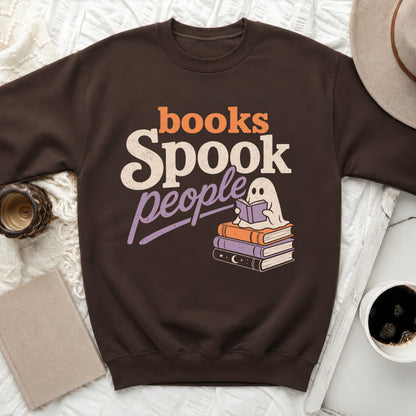 Brown sweatshirt with "books Spook people" text and a reading ghost.