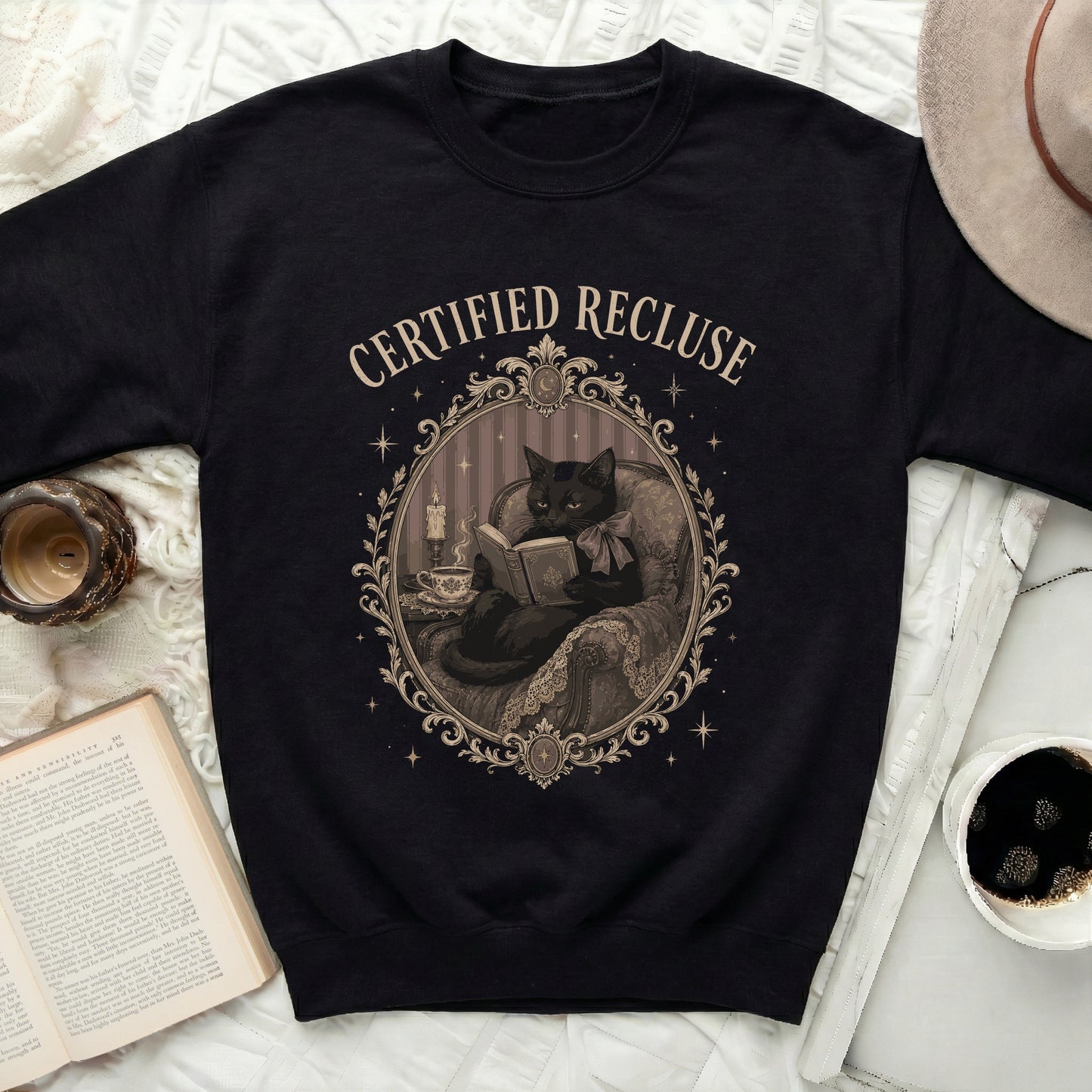 Black sweatshirt with "CERTIFIED RECLUSE" text and a black cat illustration.