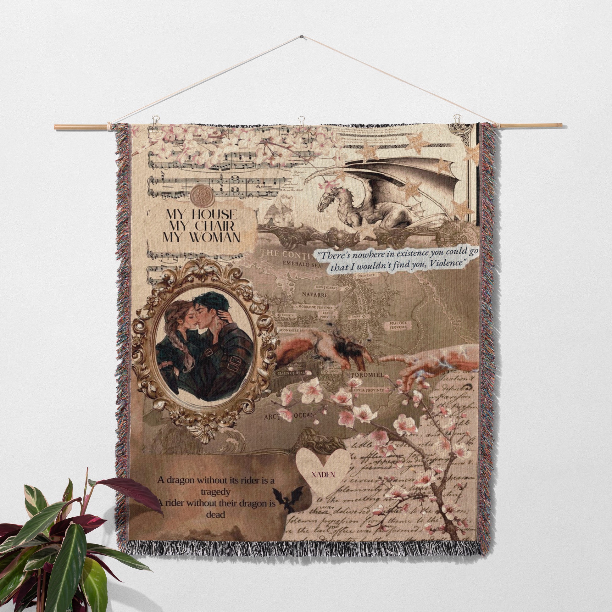 The image is a tapestry hanging on a wall, featuring a dragon, a couple embracing, and various other elements such as a map, flowers, and text.