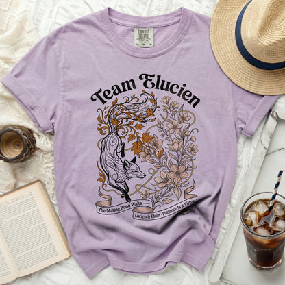 Lavender t-shirt with a fox and floral design, text reads "Team Elucien"