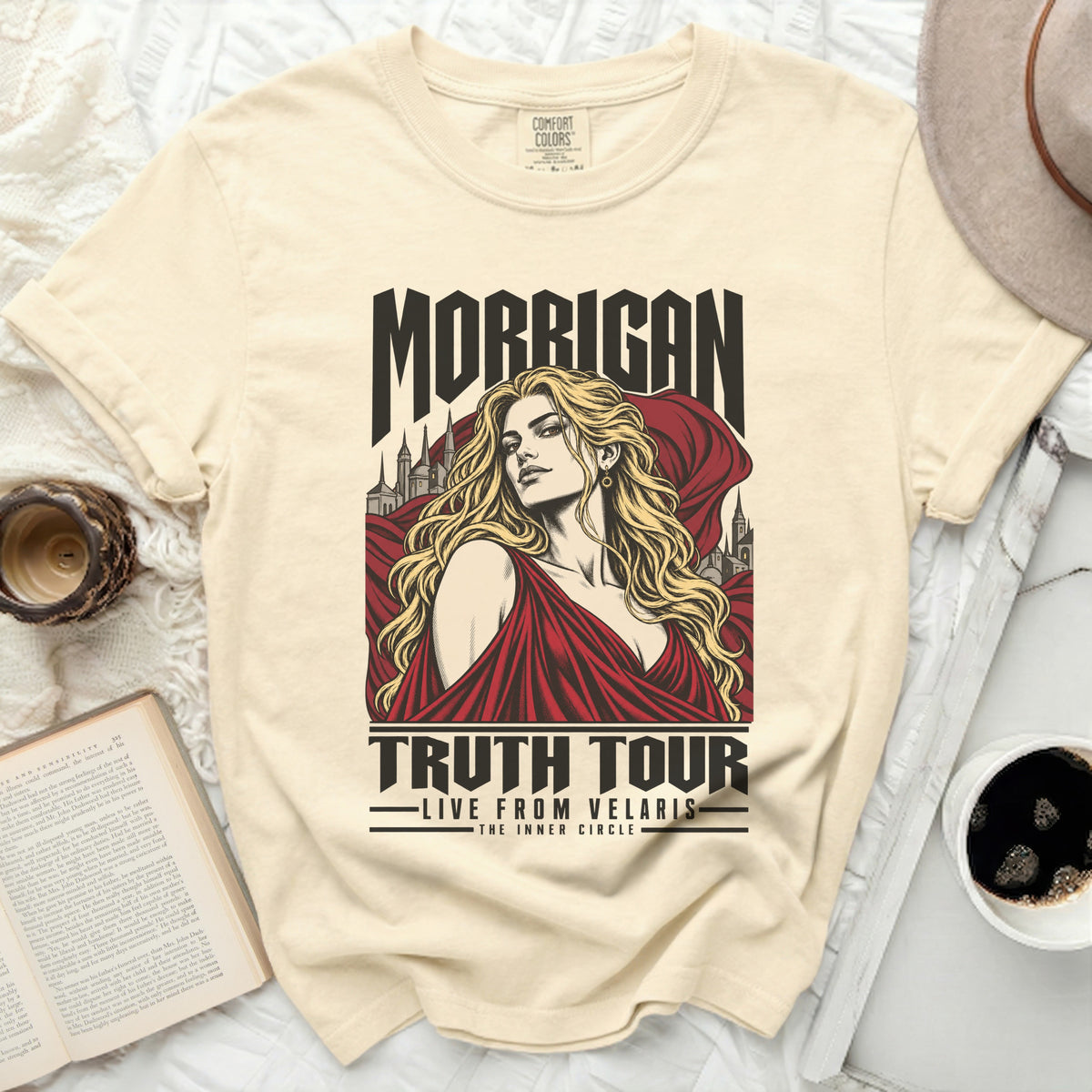 Cream t-shirt with Morrigan Truth Tour graphic featuring a woman and castles.