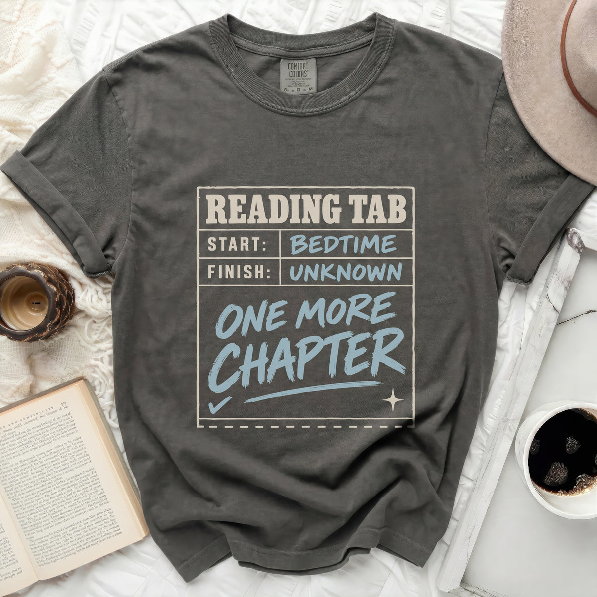 Comfort Colors t-shirt with "Reading Tab: Start Bedtime, Finish Unknown, One More Chapter" graphic.