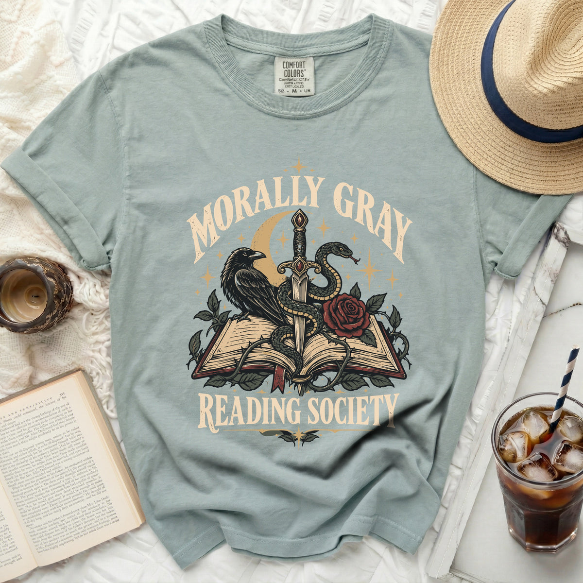 T-shirt with "Morally Gray Reading Society" graphic featuring raven, sword, snake, and book.