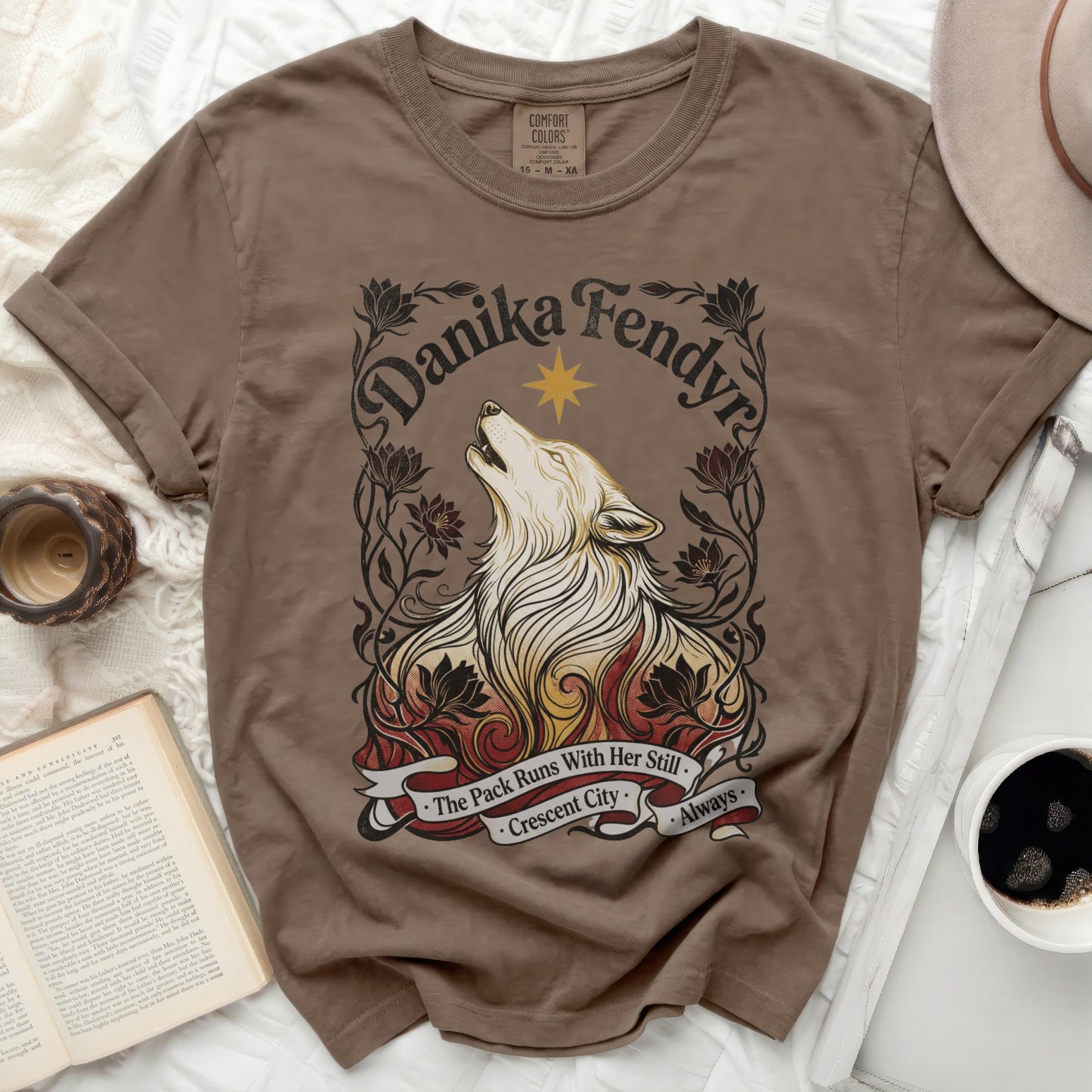 Brown t-shirt with Danika Fendyra wolf and floral design.