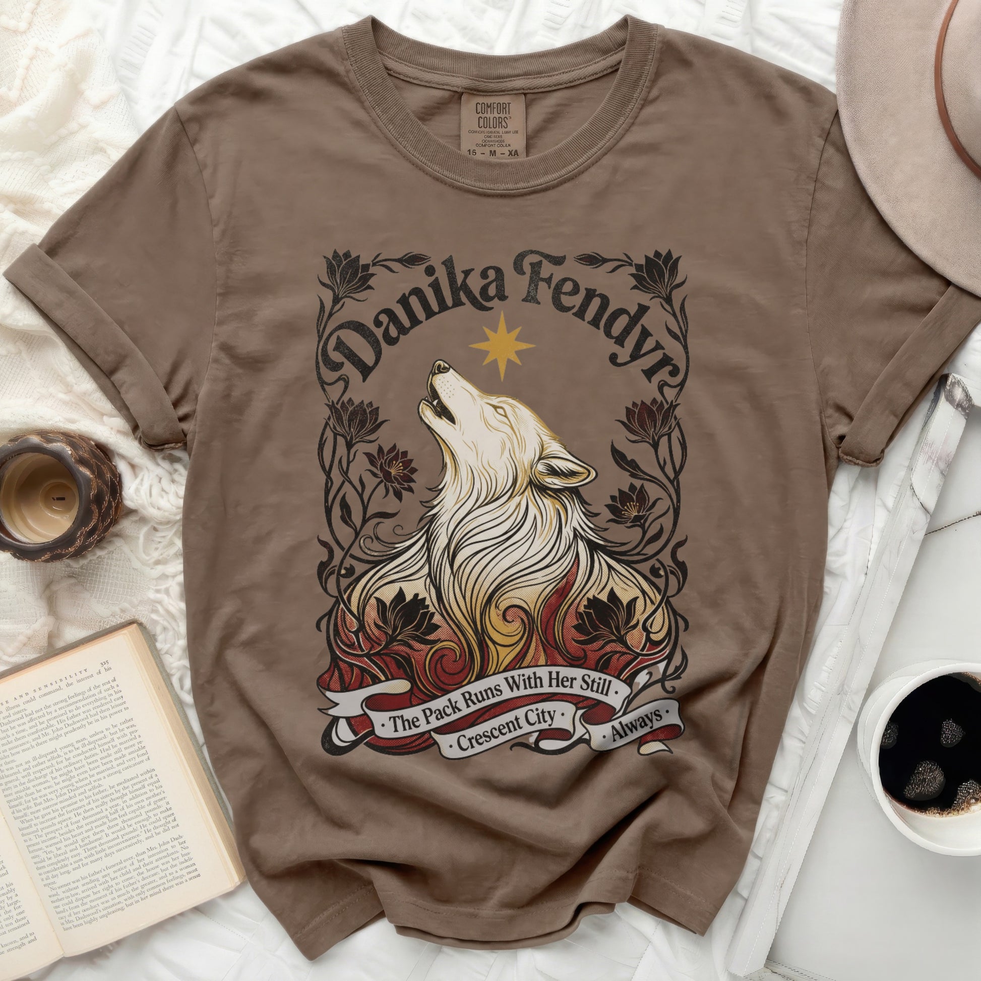 Brown t-shirt with Danika Fendyra wolf and floral design.