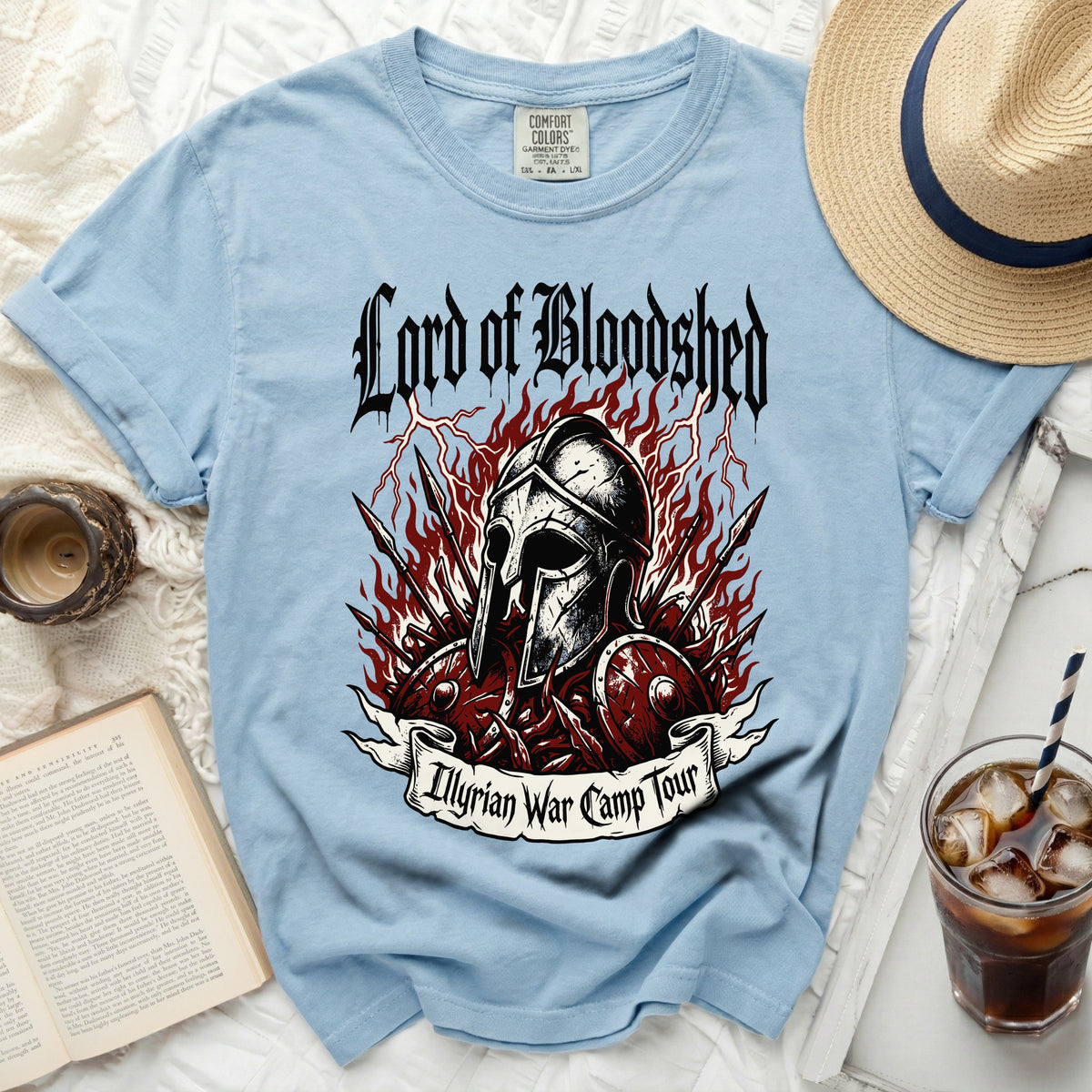 Light blue t-shirt with "Lord of Bloodshed" and "Illyrian War Camp Tour" graphics.