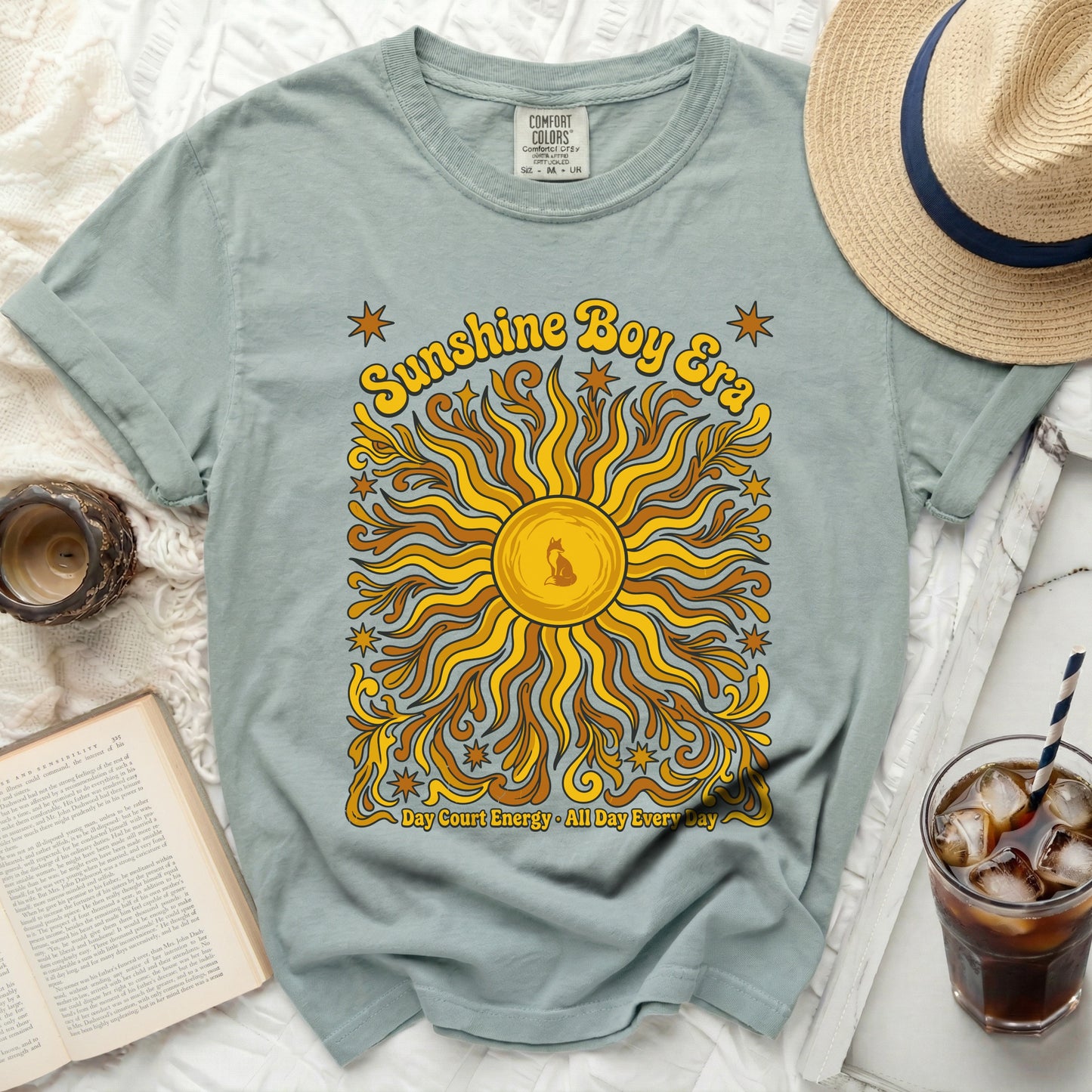 Sunshine Boy Era graphic tee with sun and stars design.
