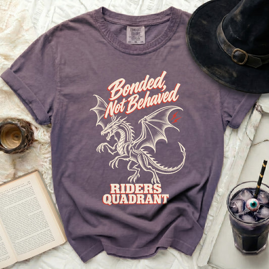 Purple t-shirt with dragon graphic and text "Bonded, Not Behaved RIDERS QUADRANT".