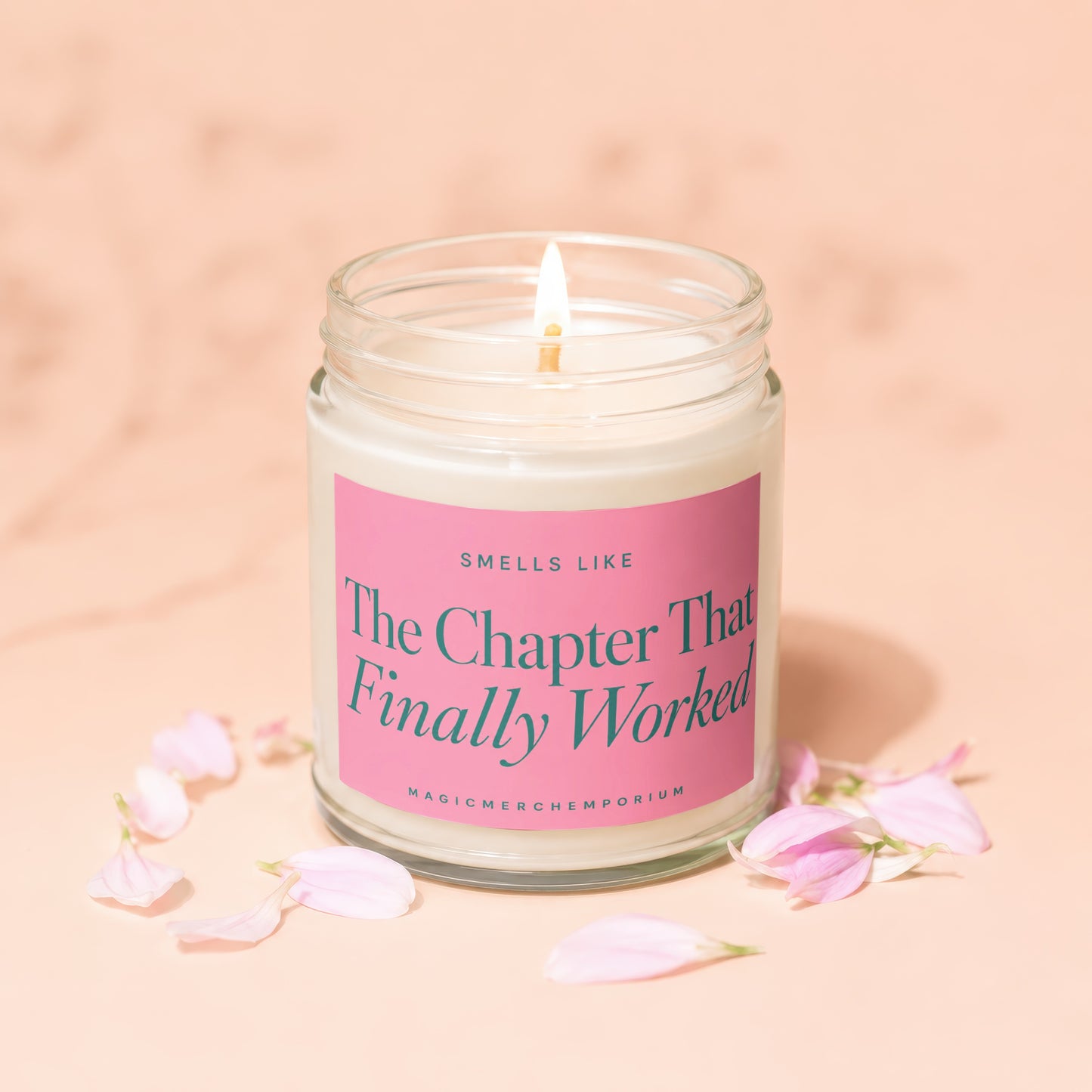 Lit candle with "The Chapter That Finally Worked" text on a pink label.