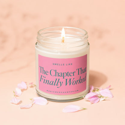 Lit candle with "The Chapter That Finally Worked" text on a pink label.