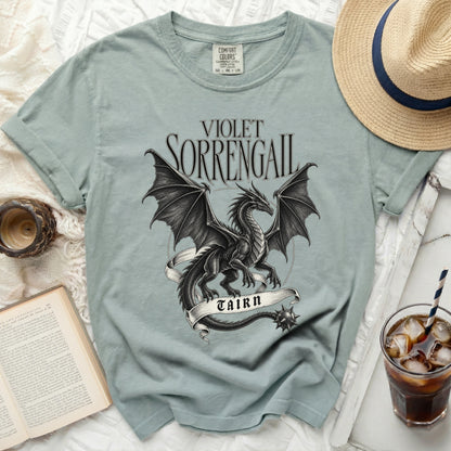 Light blue t-shirt with black dragon graphic and "VIOLET SORRENGAIL TAIRN" text.