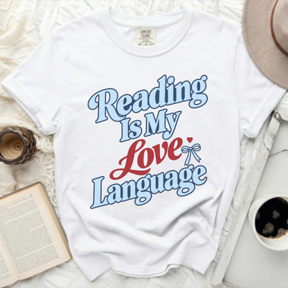 White t-shirt with "Reading Is My Love Language" text in blue and red.