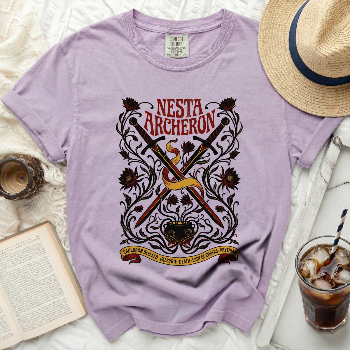 Purple Comfort Colors t-shirt with Nesta Archeron sword and cauldron graphic.