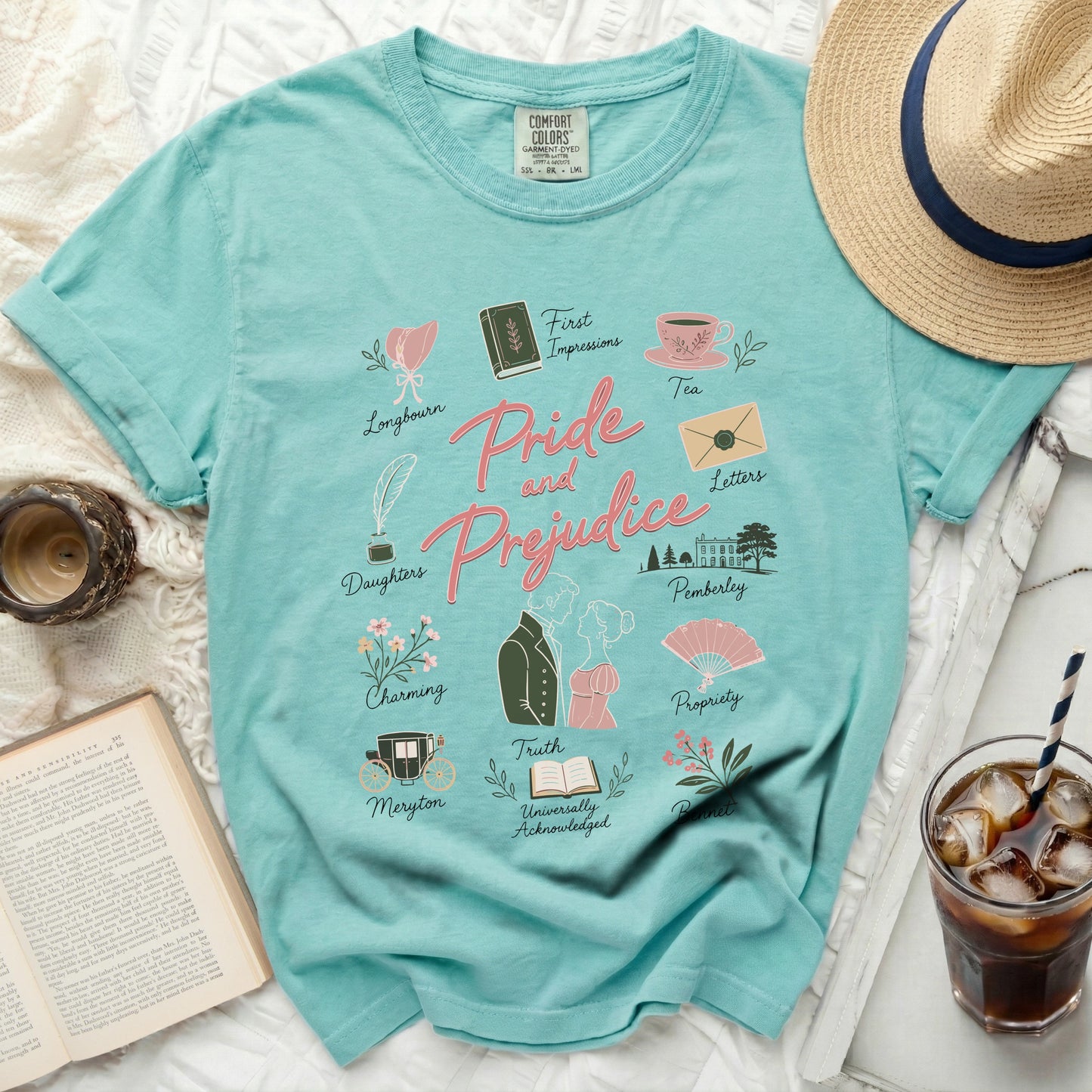 Teal t-shirt with Pride and Prejudice motifs and text.