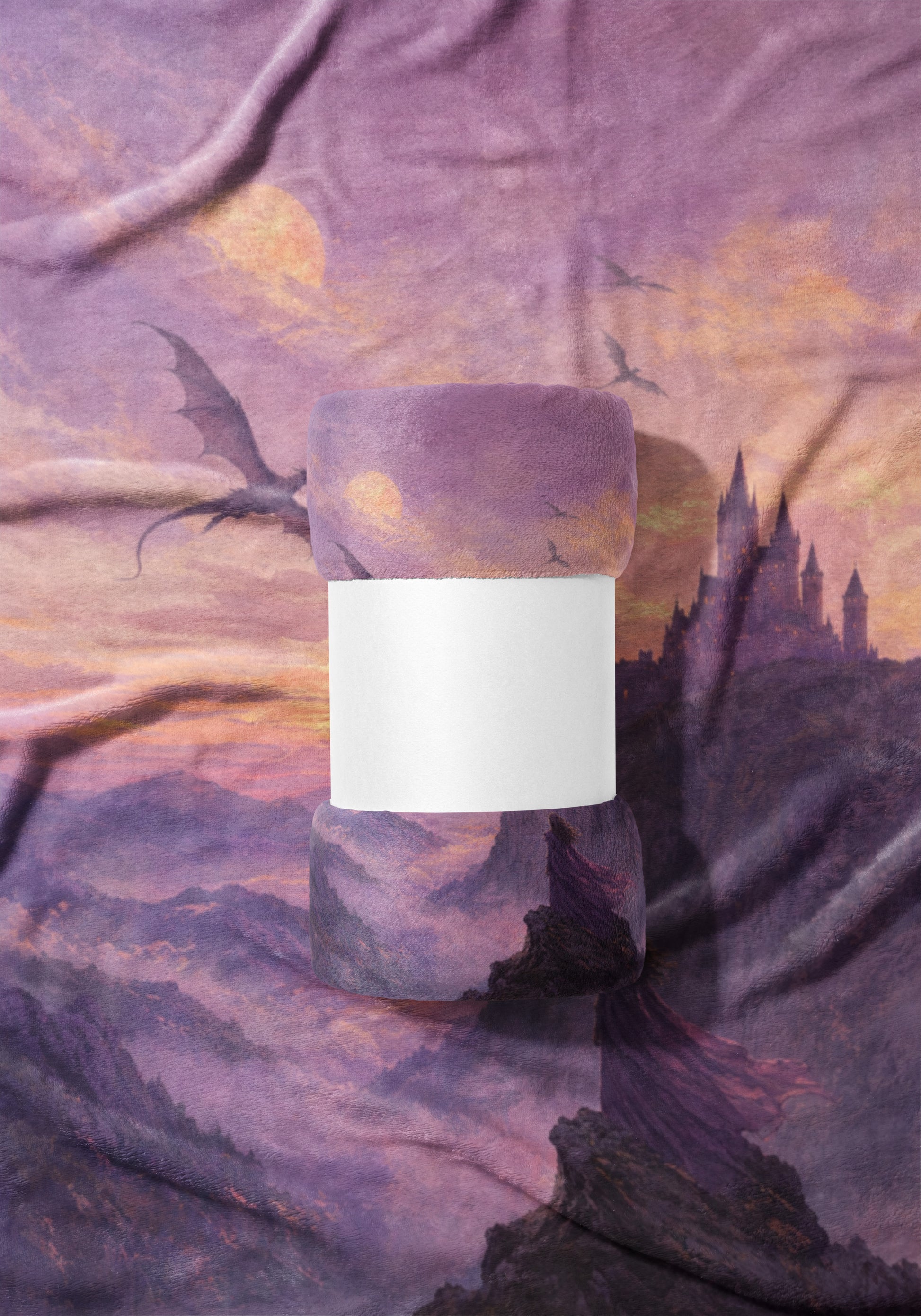 Rolled purple blanket with dragon and castle fantasy art and blank white band.