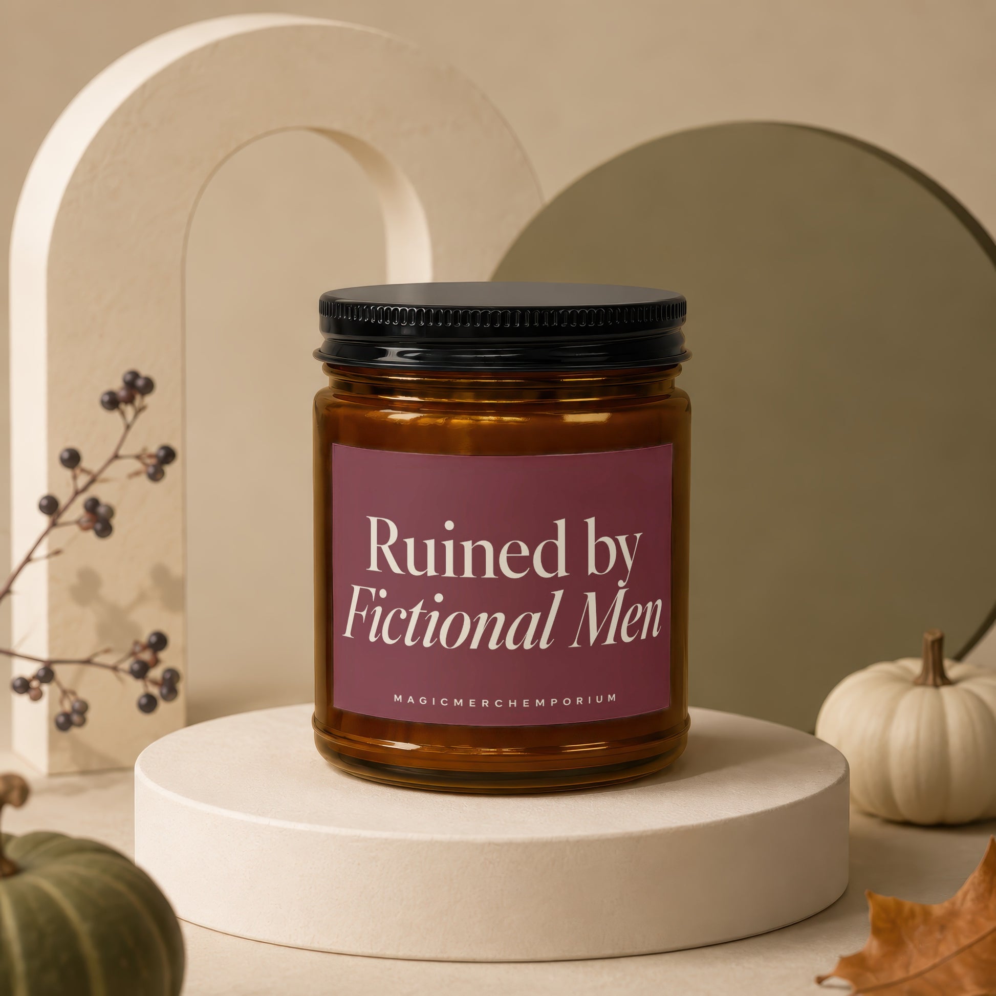 Amber candle in glass jar with maroon label reading "Ruined by Fictional Men".