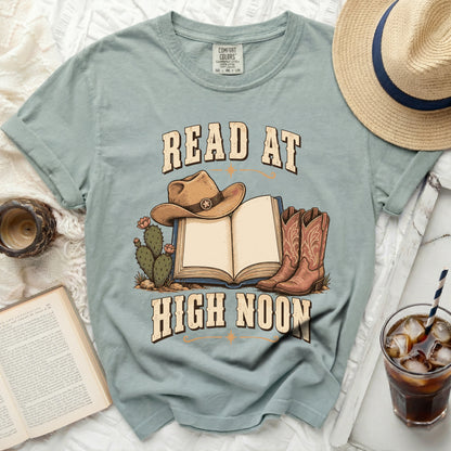 T-shirt with "Read at High Noon" text, cowboy hat, book, and boots.
