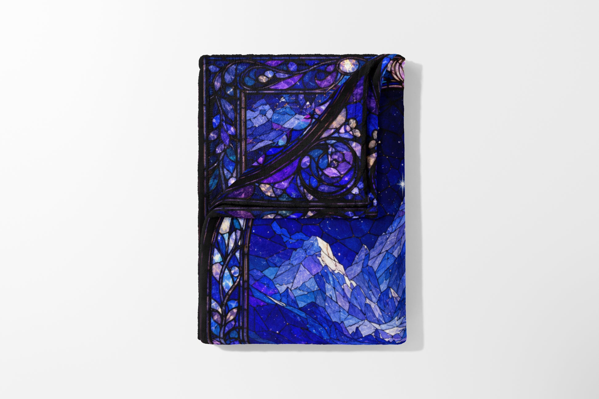 Comforter with a blue and purple stained glass mountain and night sky design.