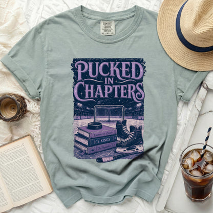 T-shirt with "Pucked in Chapters" hockey and book graphic.