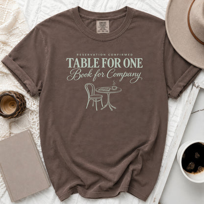 Brown t-shirt with "Reservation Confirmed Table For One Book for Company" text.