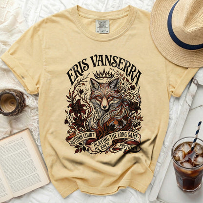 Yellow t-shirt featuring a stylized fox and crown with text "ERIS VANSARRA" and "AUTUMN COURT PLAYING THE LONG GAME HE KNEW PRYTHIAN".