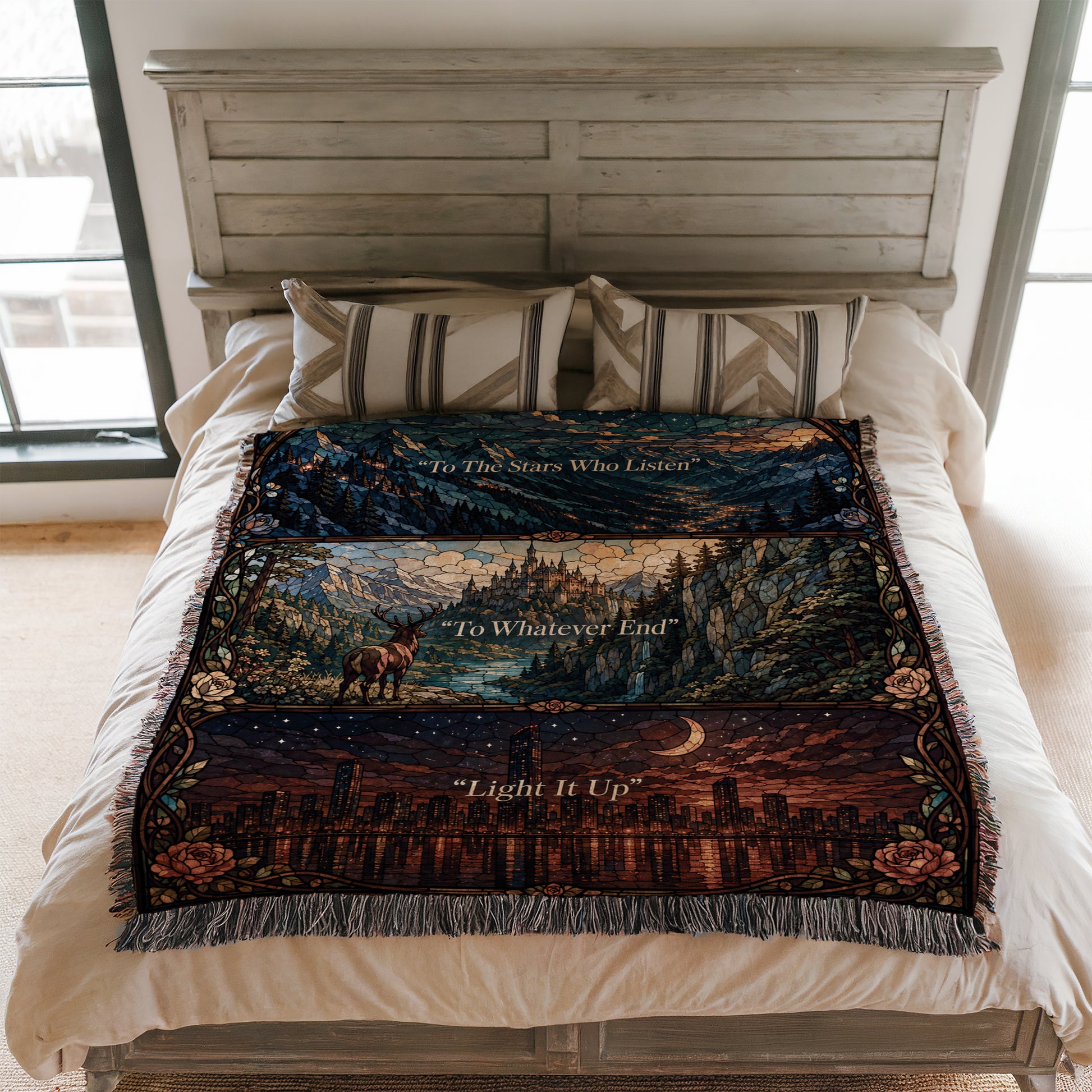 a bed with a colorful, patterned blanket that has a mountain landscape design. The blanket is spread out on the bed, covering the entire surface.
