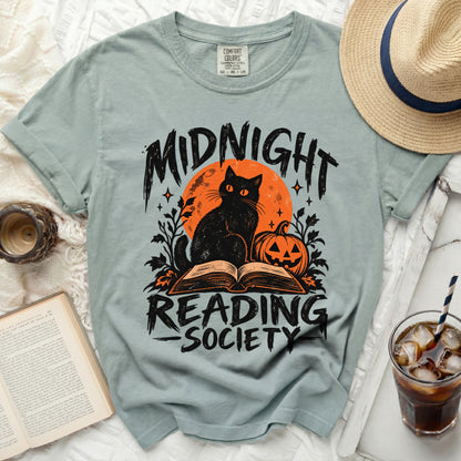 T-shirt with black cat, pumpkin, and "Midnight Reading Society" text.