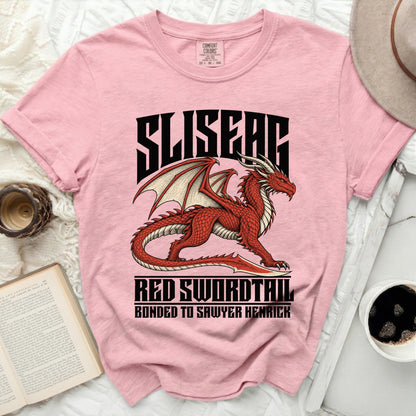 Pink t-shirt with a red dragon graphic and text: "SLISEAG RED SWORDTAIL BONDED TO SAWYER HENRICK".