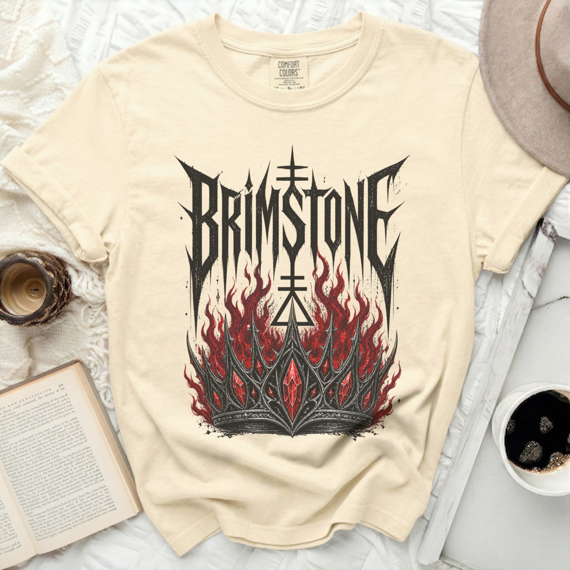 Cream t-shirt with "BRIMSTONE" text and a fiery crown graphic.