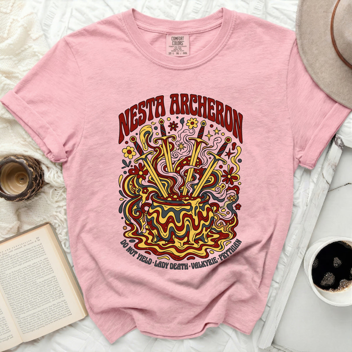 Pink t-shirt with "NESTA ARCHERON" and "DO NOT YIELD LADY DEATH VALKYRIE PRYTHIAN" text and graphic.