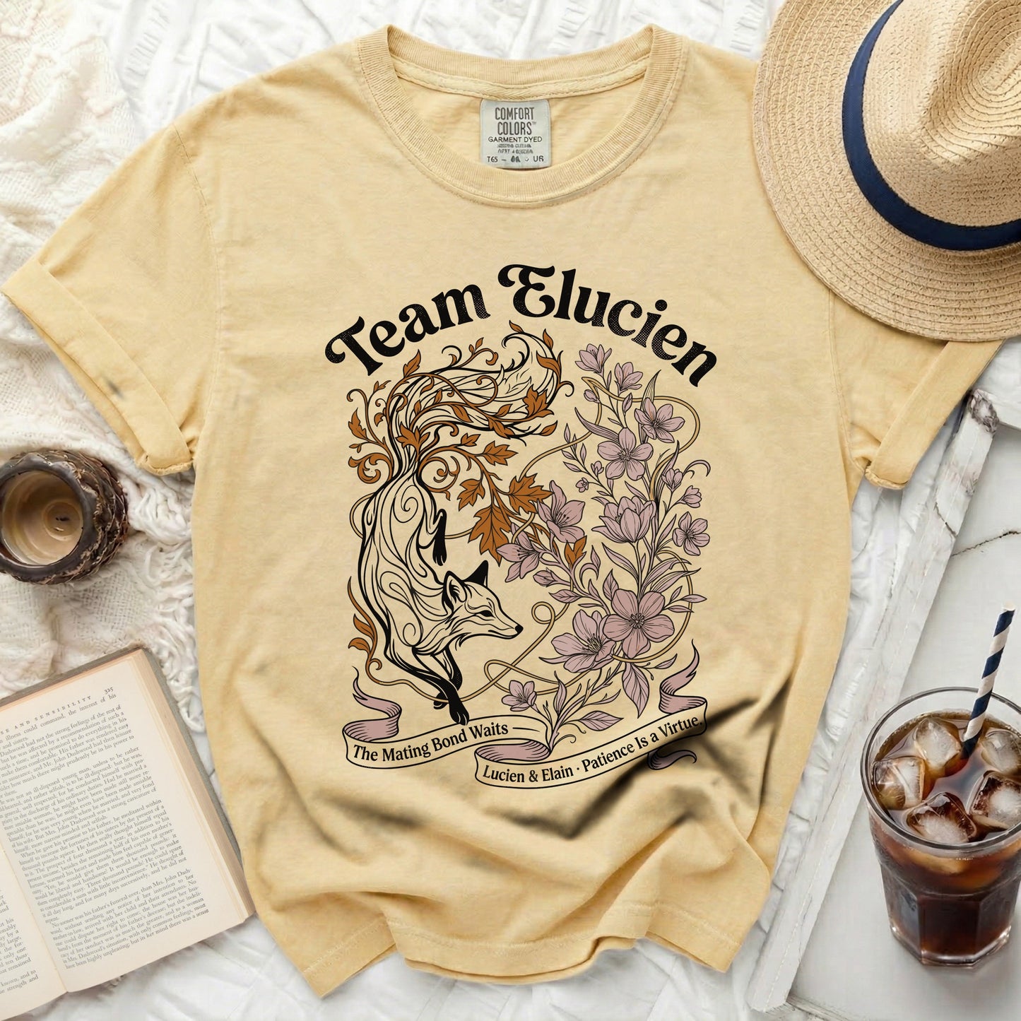 Yellow t-shirt with "Team Elucien" and a fox with flowers design.