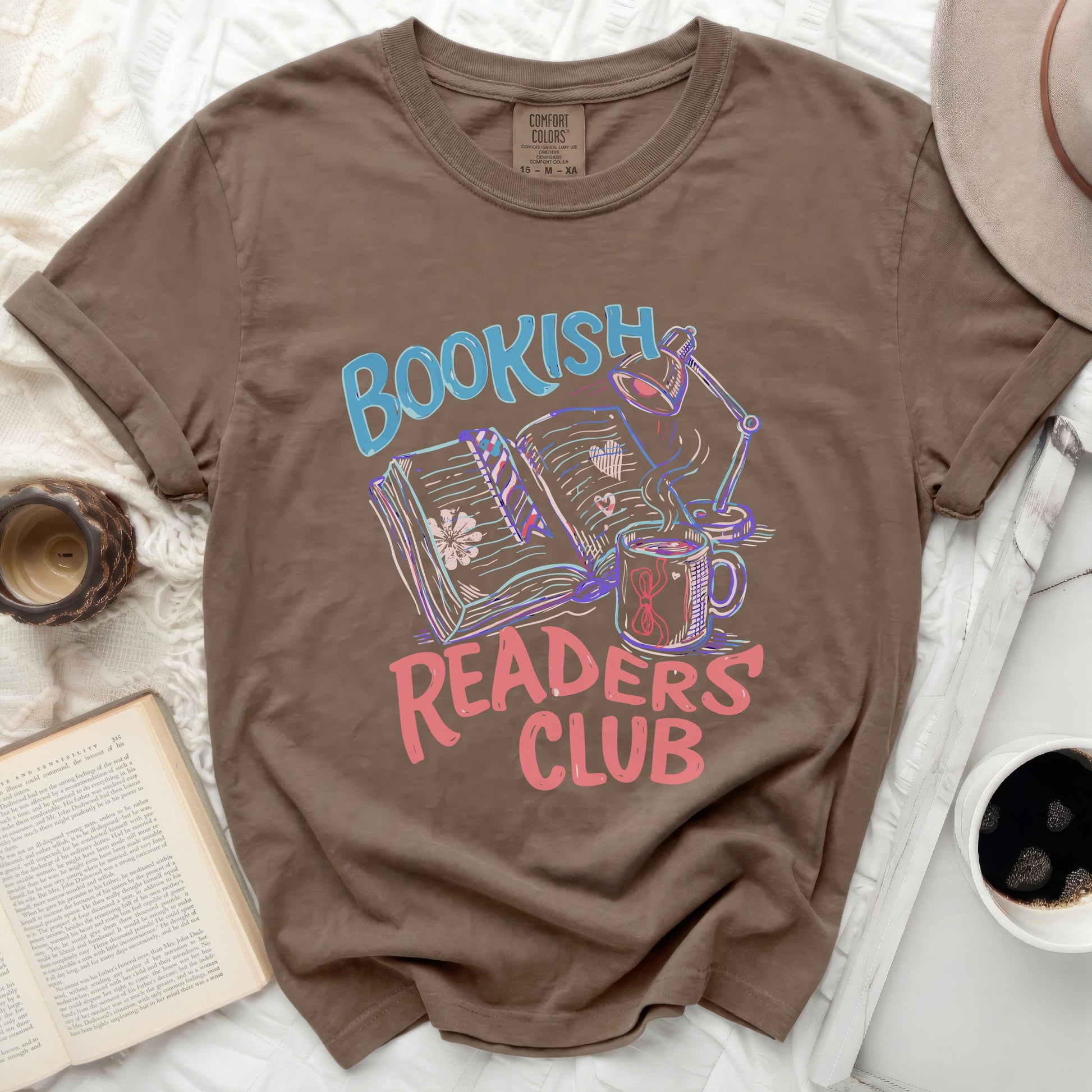T-shirt with "Bookish Readers Club" graphic, featuring books, lamp, and mug.