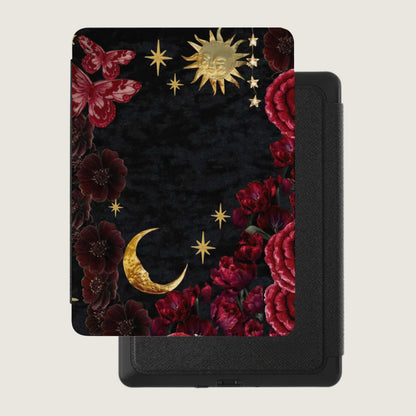 Tilted tablet with mystical floral, moon, sun, and butterfly design on black background.