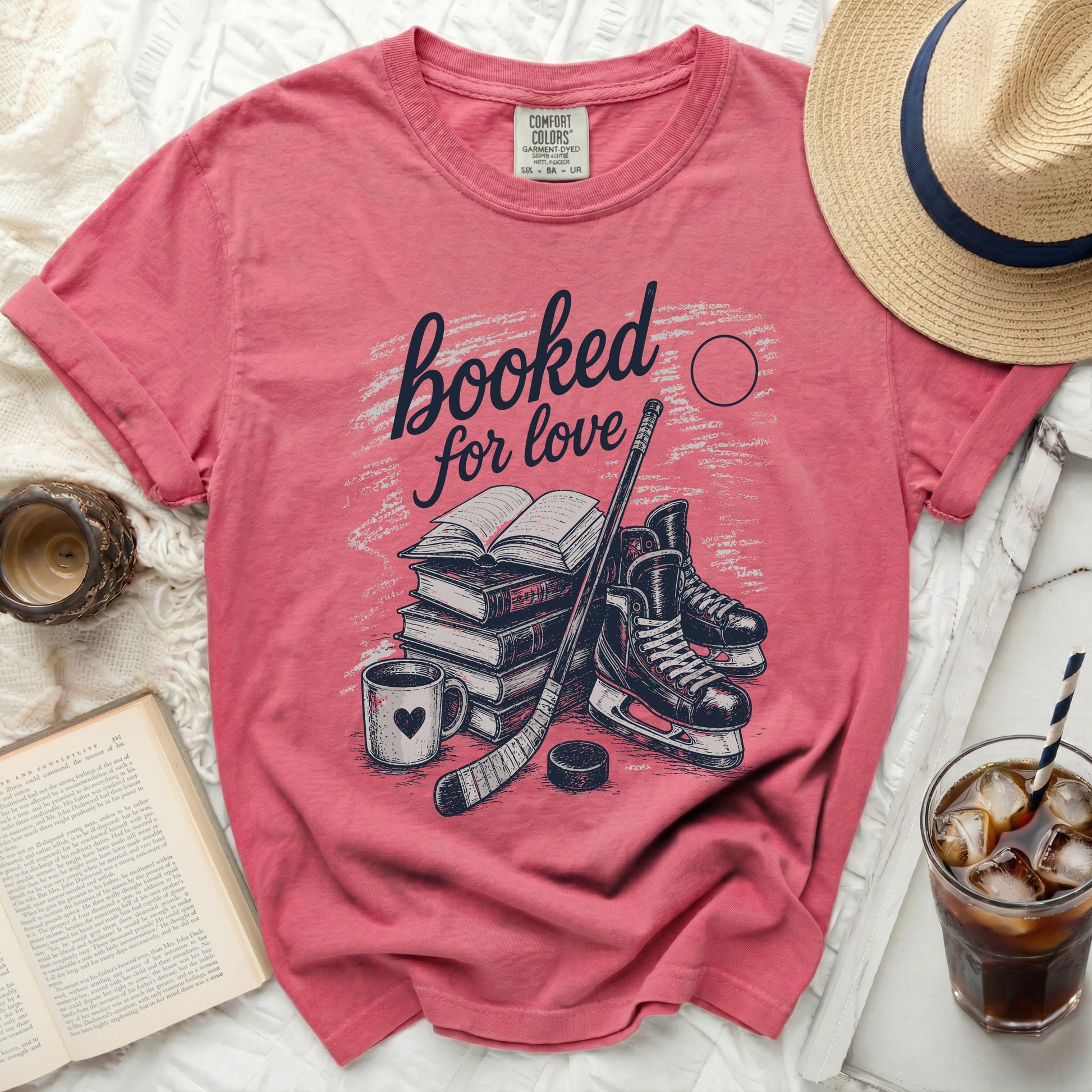 Pink t-shirt with "booked for love" and hockey imagery.