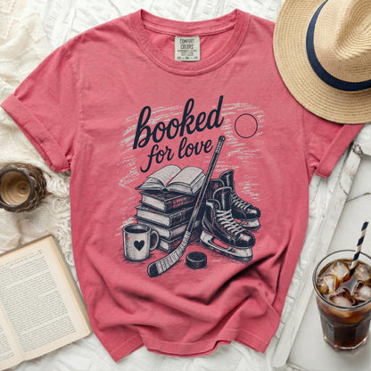 Pink t-shirt with "booked for love" and hockey imagery.