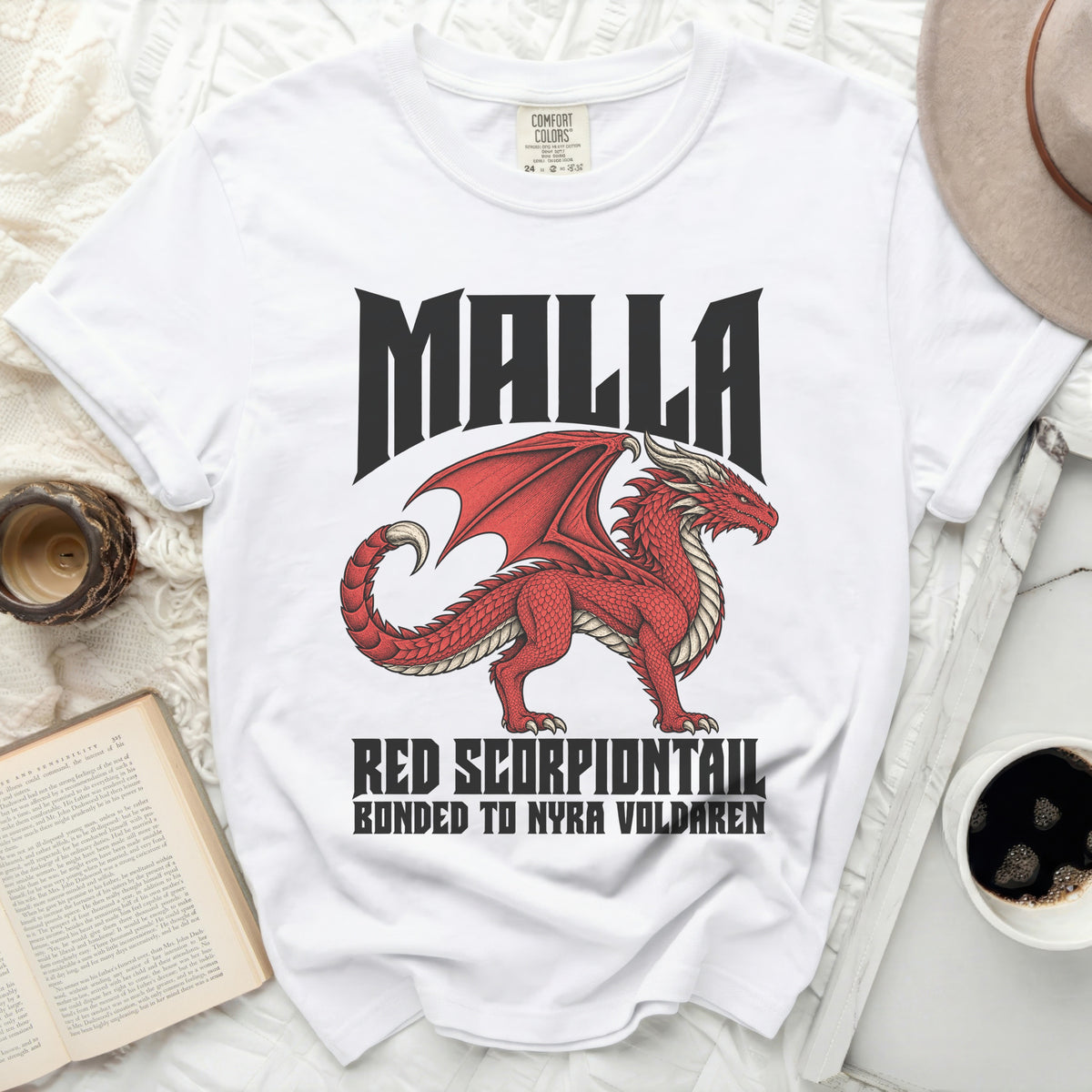 White t-shirt with red dragon graphic and text "MALLA RED SCORPIONTAIL BONDED TO NYRA VOLDAREN".